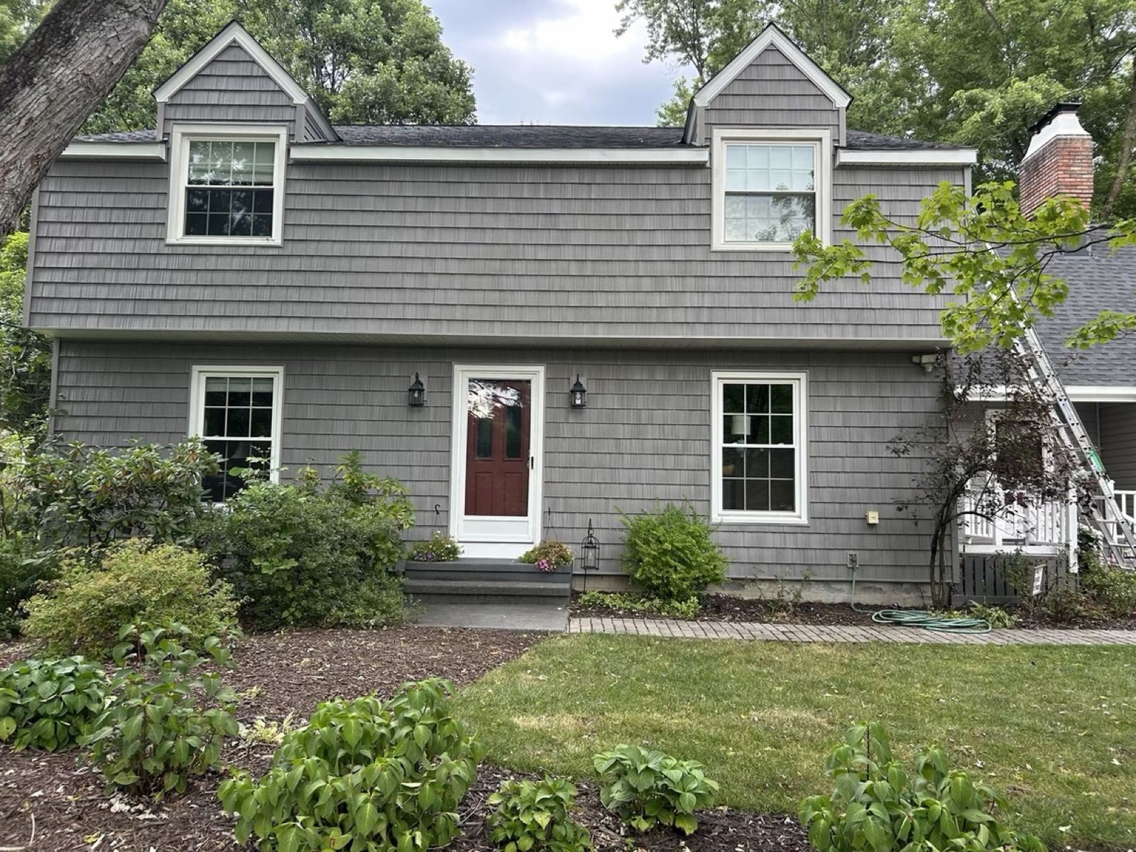 Gray Cape Cod home with two dormers